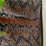 Amber Dusk Handloom Blanket – A fully handwoven cotton throw in rich amber and black hues, crafted using traditional handloom techniques.