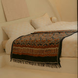 Amber Dusk Handloom Blanket – A fully handwoven cotton throw in rich amber and black hues, crafted using traditional handloom techniques.