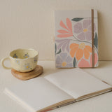 A5 Blossom Daydream handmade floral journal with pink and purple pastel flowers, recycled pages, flower pen, and dust bag – ideal for scrapbooking or journaling