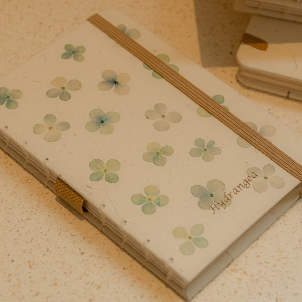 A6 recycled journal with real hydrangea flower cover, flower pen, and dust bag