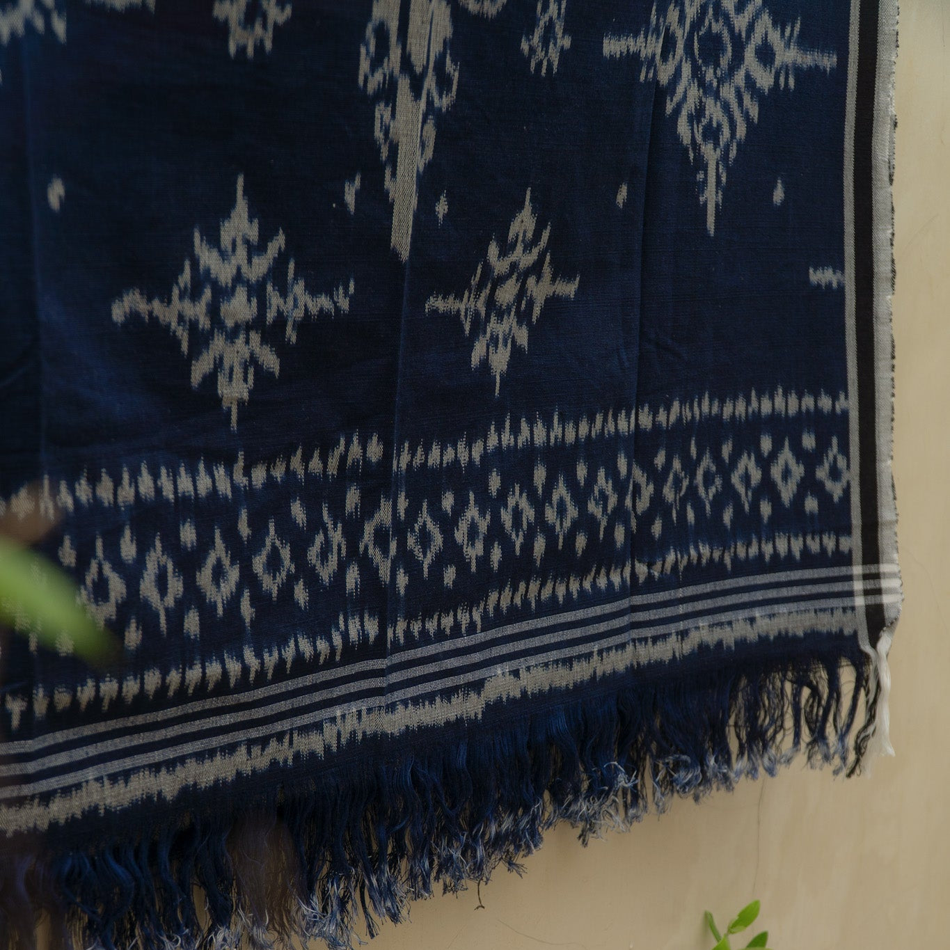 Indigo Eclipse Handloom Blanket, handwoven from 100% natural cotton with intricate patterns in deep indigo hues, crafted using traditional techniques.