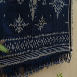 Indigo Eclipse Handloom Blanket, handwoven from 100% natural cotton with intricate patterns in deep indigo hues, crafted using traditional techniques.