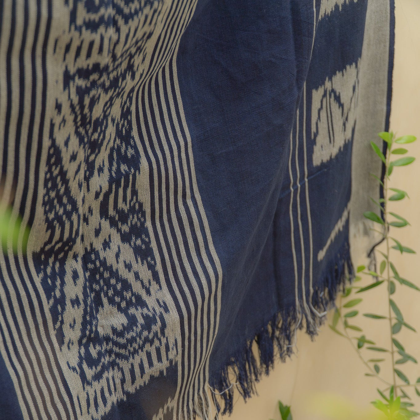 Indigo Horizon Handloom Blanket – A fully handwoven cotton throw with intricate patterns, crafted using traditional handloom techniques.