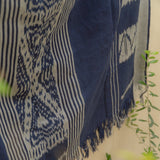 Indigo Horizon Handloom Blanket – A fully handwoven cotton throw with intricate patterns, crafted using traditional handloom techniques.