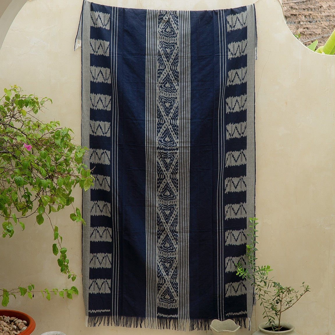 Indigo Horizon Handloom Blanket – A fully handwoven cotton throw with intricate patterns, crafted using traditional handloom techniques.