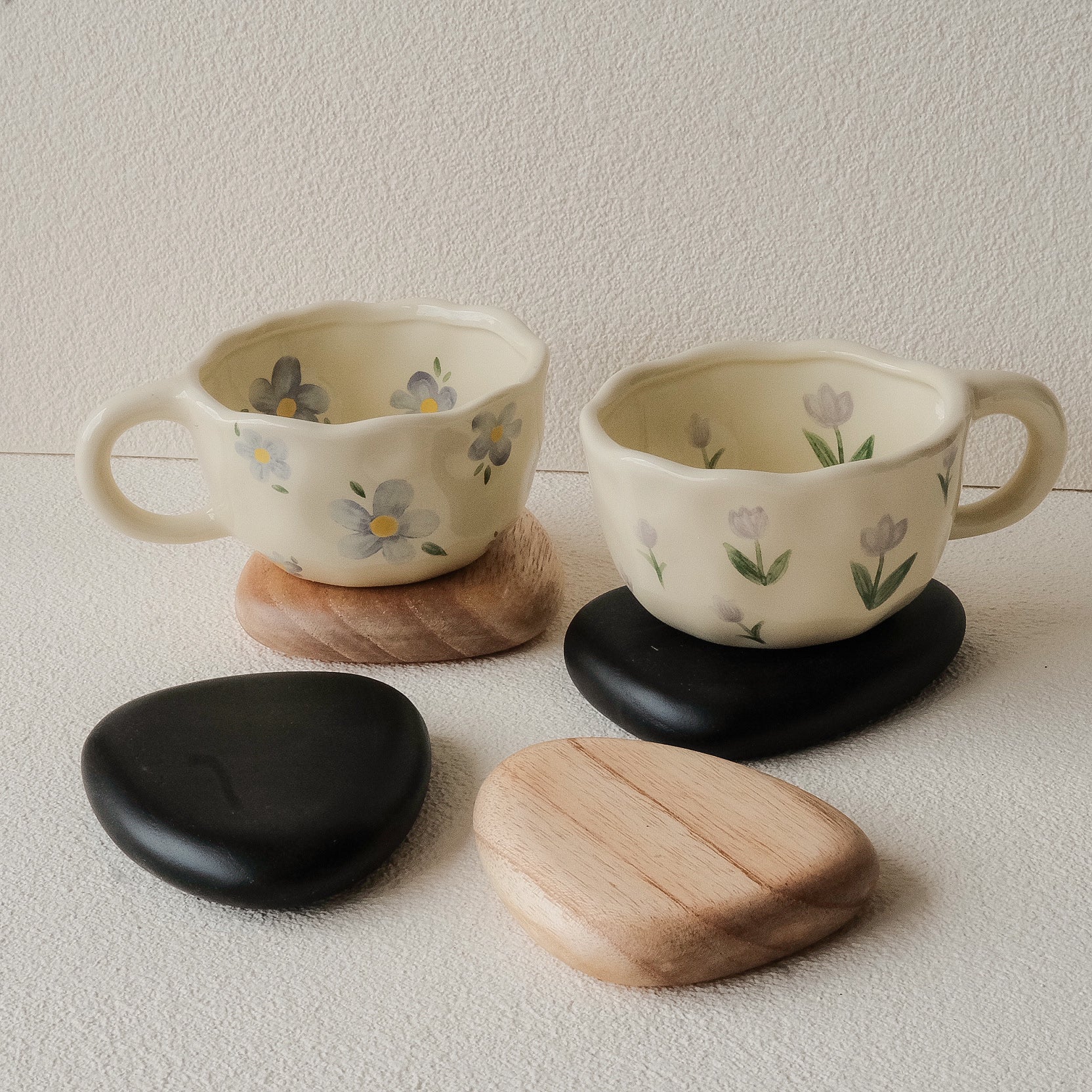 Set of 4 handcrafted Nami Wooden Pebble Coasters – available in Natural and Black Noir finish, wide smooth curved surface, eco-conscious Japandi style