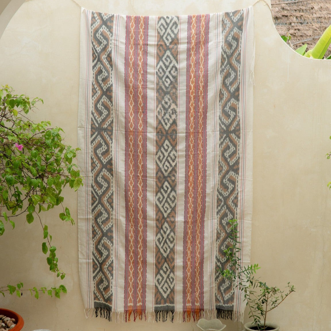 Sierra Handloom Blanket featuring a geometric pattern in earthy tones, crafted using traditional handloom techniques