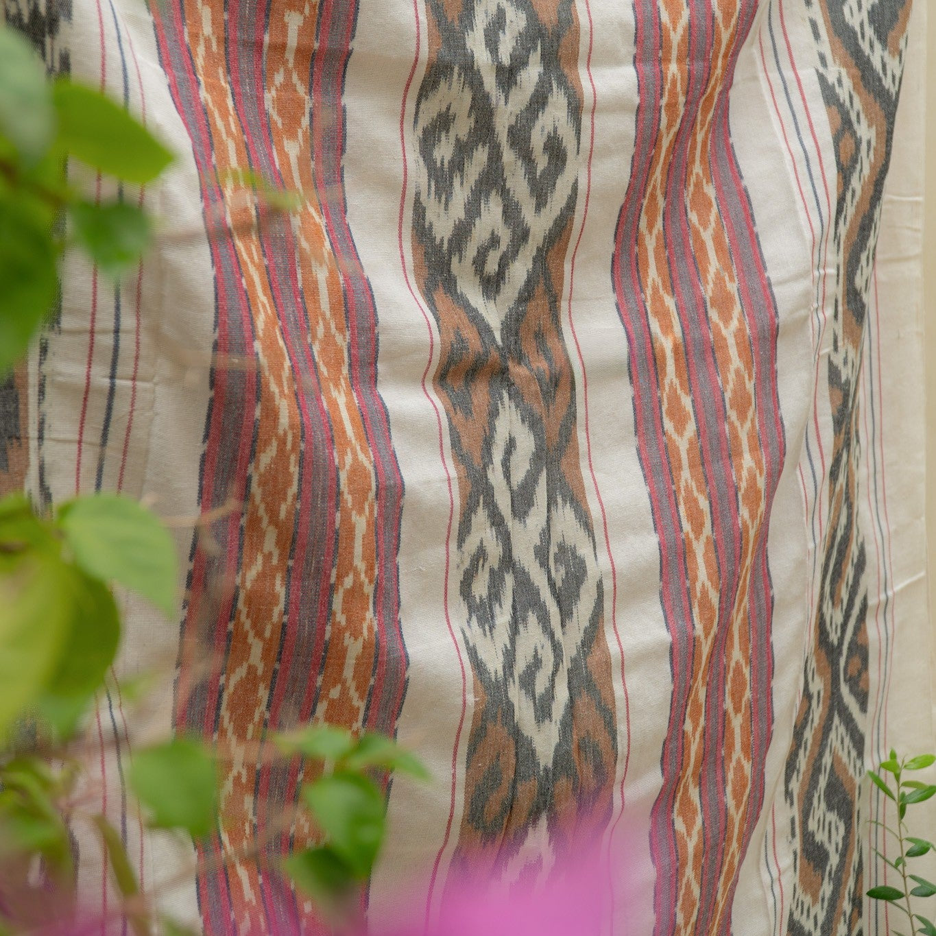 Sierra Handloom Blanket featuring a geometric pattern in earthy tones, crafted using traditional handloom techniques