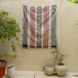 Sierra Handloom Blanket featuring a geometric pattern in earthy tones, crafted using traditional handloom techniques.