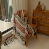 Sierra Handloom Blanket featuring a geometric pattern in earthy tones, crafted using traditional handloom techniques.