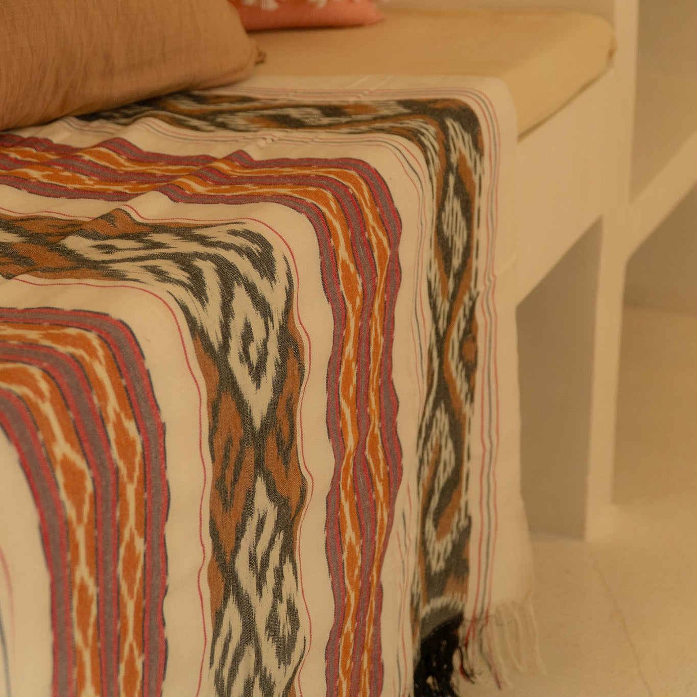 Sierra Handloom Blanket featuring a geometric pattern in earthy tones, crafted using traditional handloom techniques.