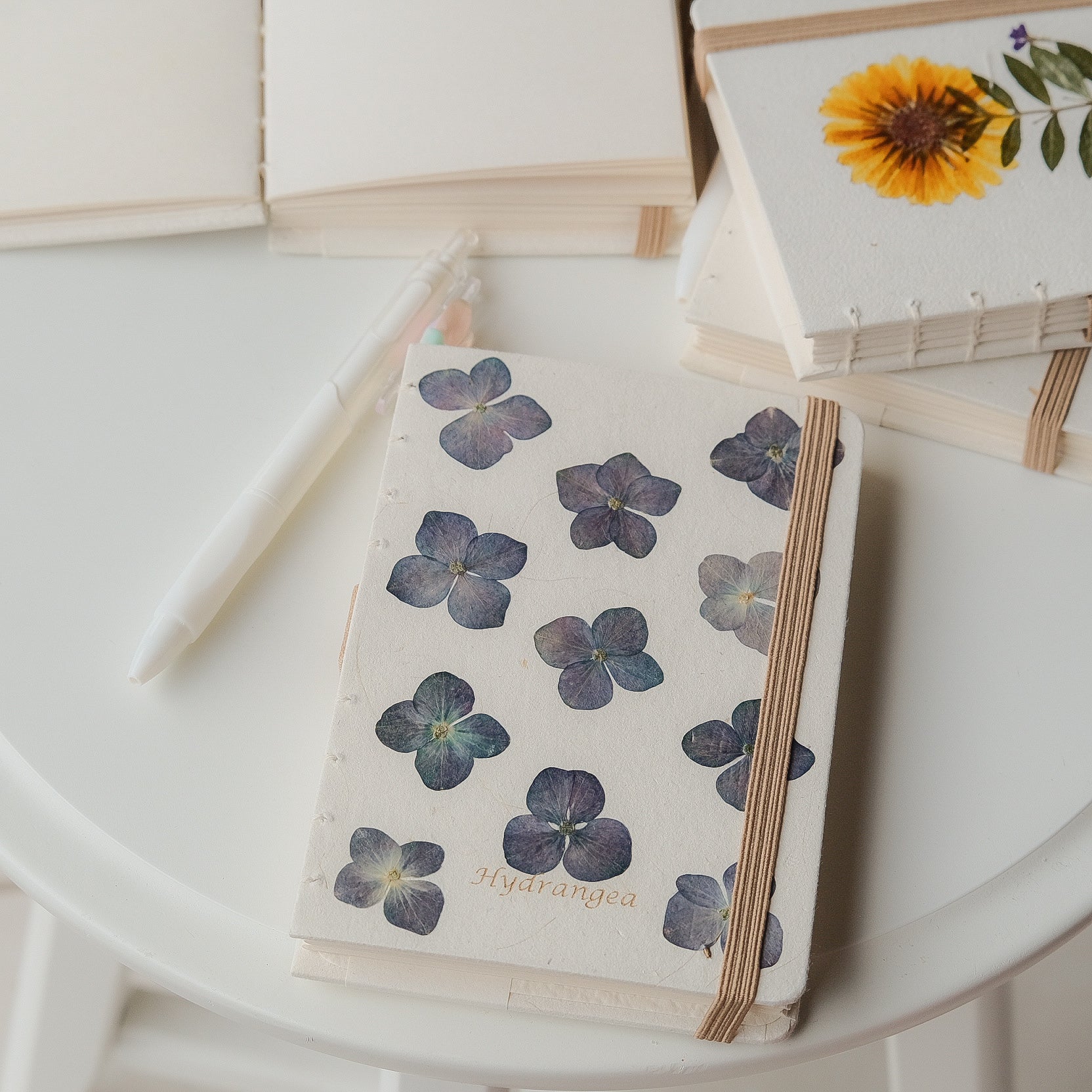 A6 recycled journal with real hydrangea flower cover, flower pen, and dust bag