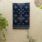 Indigo Eclipse Handloom Blanket, handwoven from 100% natural cotton with intricate patterns in deep indigo hues, crafted using traditional techniques.