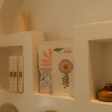A6 journal with real pressed Aster flower on cover, floral pen, and dusty pouch