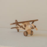 Wooden toy airplane on a light background