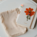 A6 cosmos flower journal with real pressed bloom on the cover, floral pen, and dust bag – colors may vary