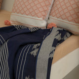 Indigo Horizon Handloom Blanket – A fully handwoven cotton throw with intricate patterns, crafted using traditional handloom techniques.