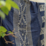 Indigo Horizon Handloom Blanket – A fully handwoven cotton throw with intricate patterns, crafted using traditional handloom techniques.