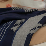 Indigo Horizon Handloom Blanket – A fully handwoven cotton throw with intricate patterns, crafted using traditional handloom techniques.