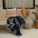 Indigo Horizon Handloom Blanket – A fully handwoven cotton throw with intricate patterns, crafted using traditional handloom techniques.