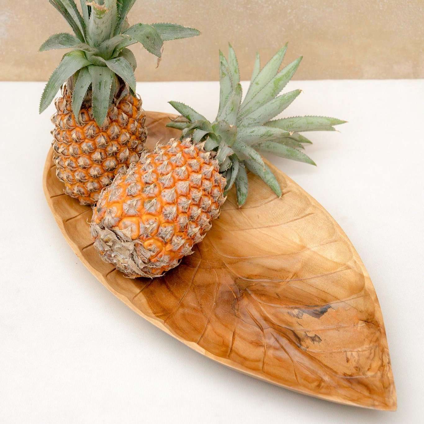 handcarved solid wood tray in leaf shape with pineaplle