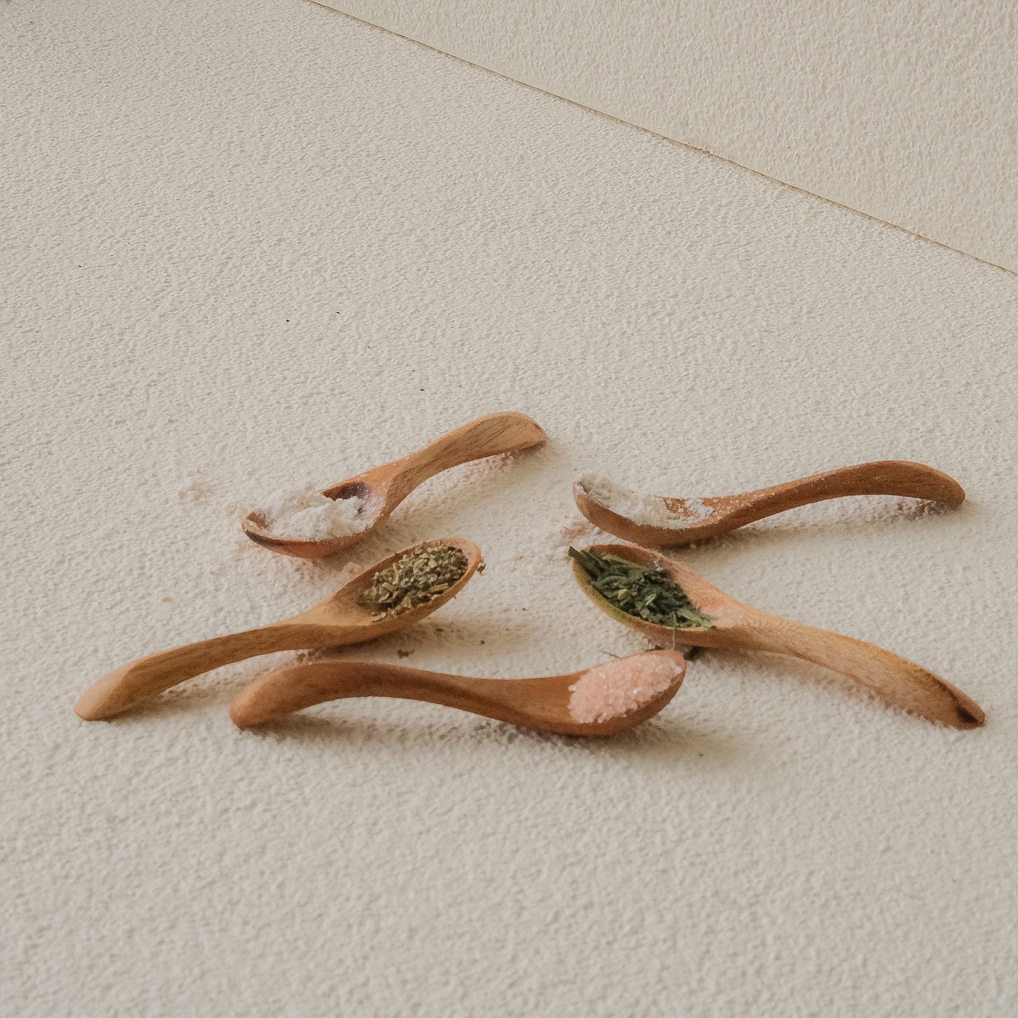 Set of 5 Lara Mini Curved Wooden Spoons handcrafted from reclaimed teak – designed for salt, spices, and herbs, fits perfectly into small kitchen jars