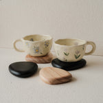 Set of 4 handcrafted Nami Wooden Pebble Coasters – available in Natural and Black Noir finish, wide smooth curved surface, eco-conscious Japandi style