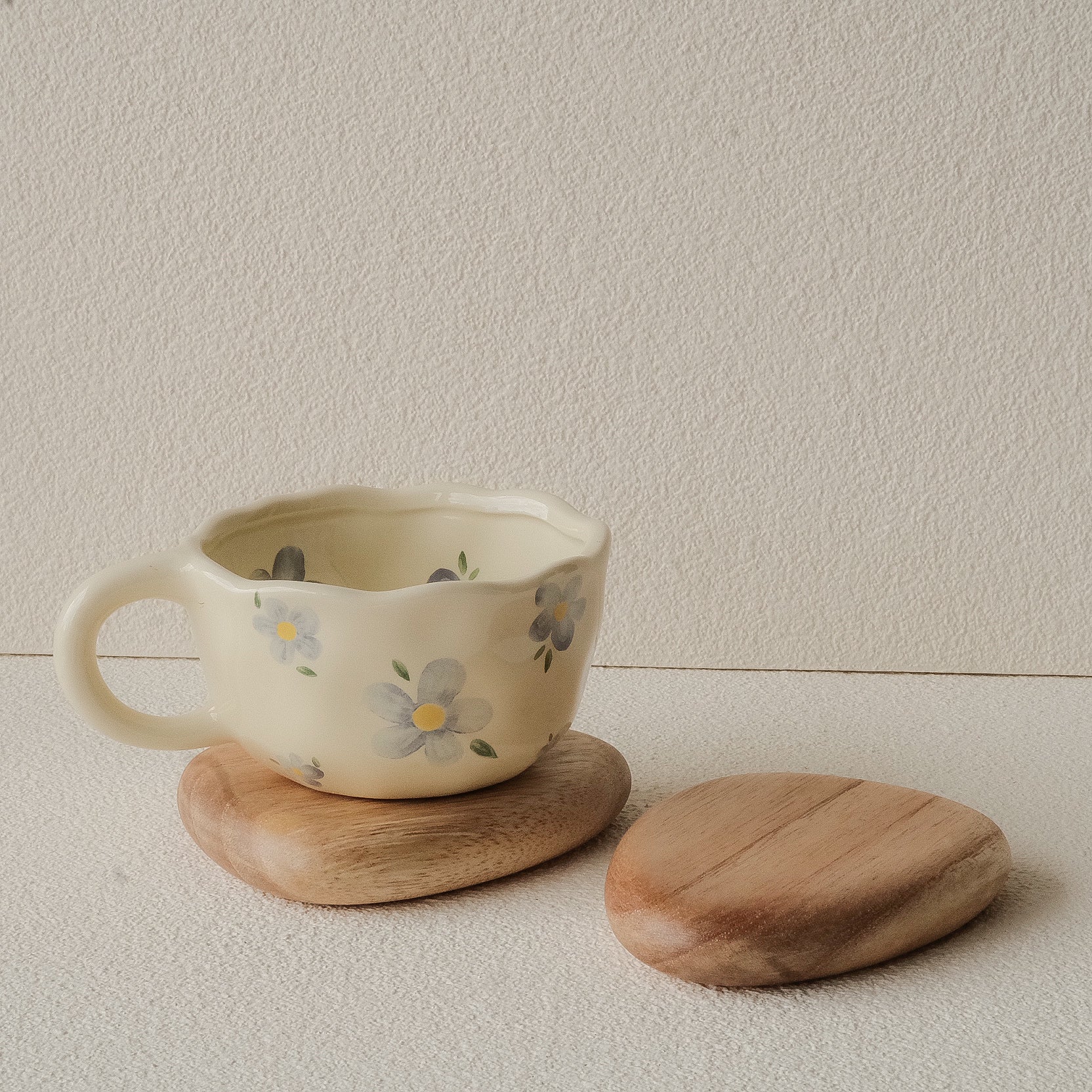 Set of 4 handcrafted Nami Wooden Pebble Coasters – available in Natural and Black Noir finish, wide smooth curved surface, eco-conscious Japandi style