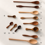 A set of ten wooden spoons in various sizes and styles, arranged vertically on a light off-white background with sequential numbers 1 through 12 next to them.