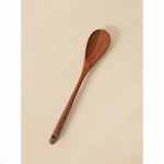 Wooden spoon with 'Kate & Co' engraving on a beige background